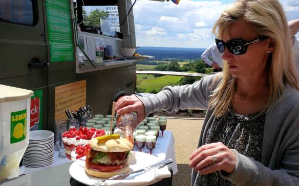 Deli Truck  "home made" "tomato sauce" onto her burger