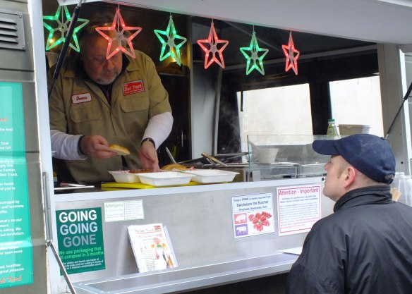 Serving our famous pulled pork sandwich tot he crowds