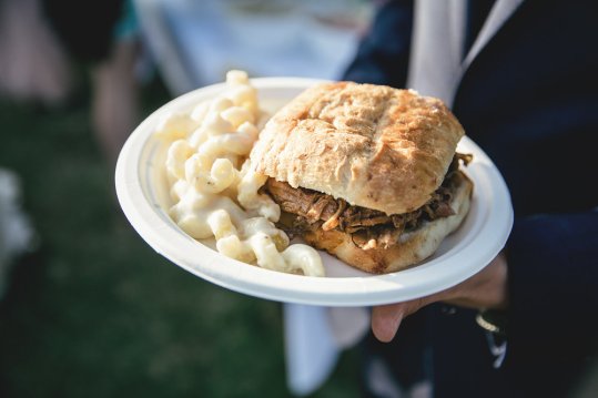 Our famous 8 hour smoked pulled pork sandwich with our delicious Mac and Cheese