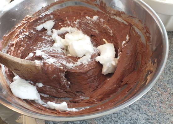 Adding egg white to the chocolate, egg yolk and cream mixture 